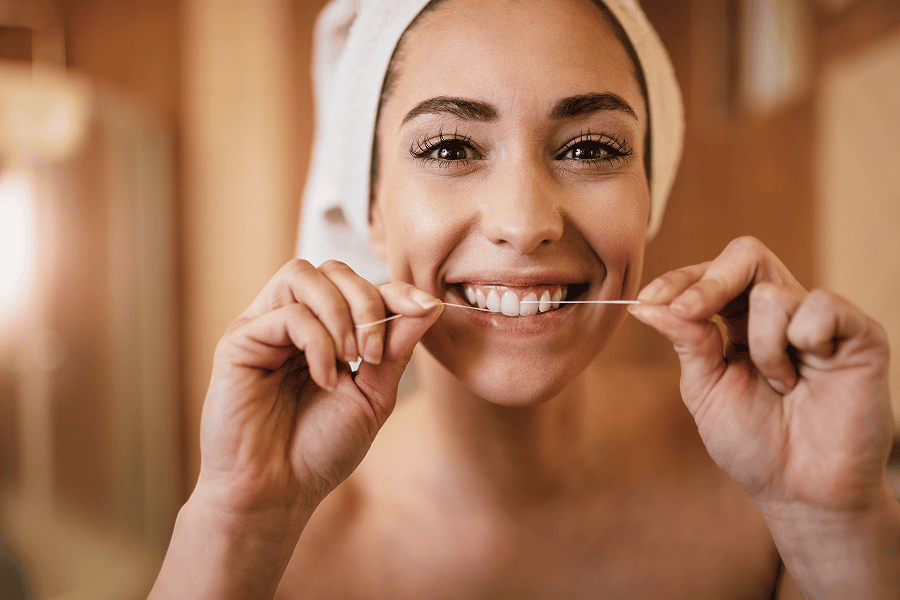 https://sorridiallavita.it/wp-content/uploads/2026/03/beautiful-woman-using-dental-floss-cleaning-her-teeth-bathroom-1.png